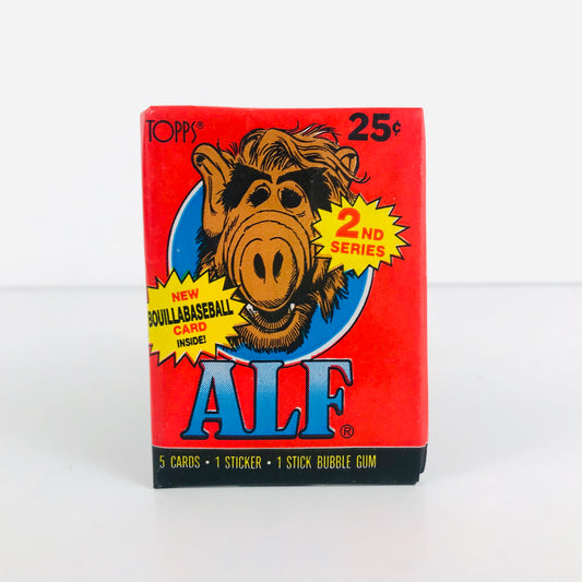 An unopened 1987 Alf wax pack with a cartoonish image of Alf the alien on the front.