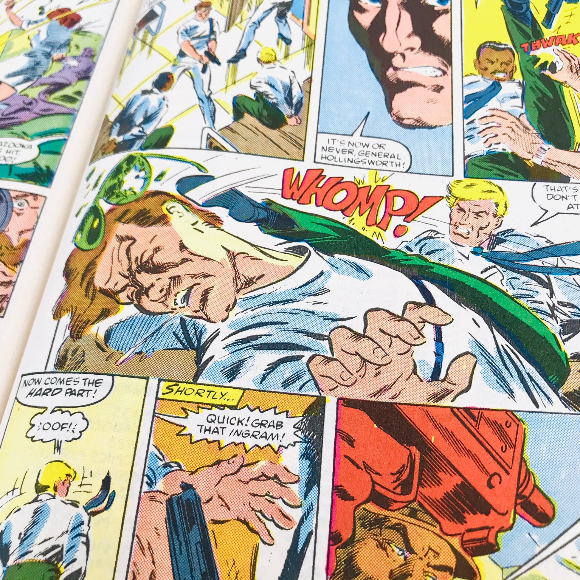 An action-packed sequence from a 1980s GI Joe comic book showing one character kicking the other with a sound effect spelled out as "Whomp!".