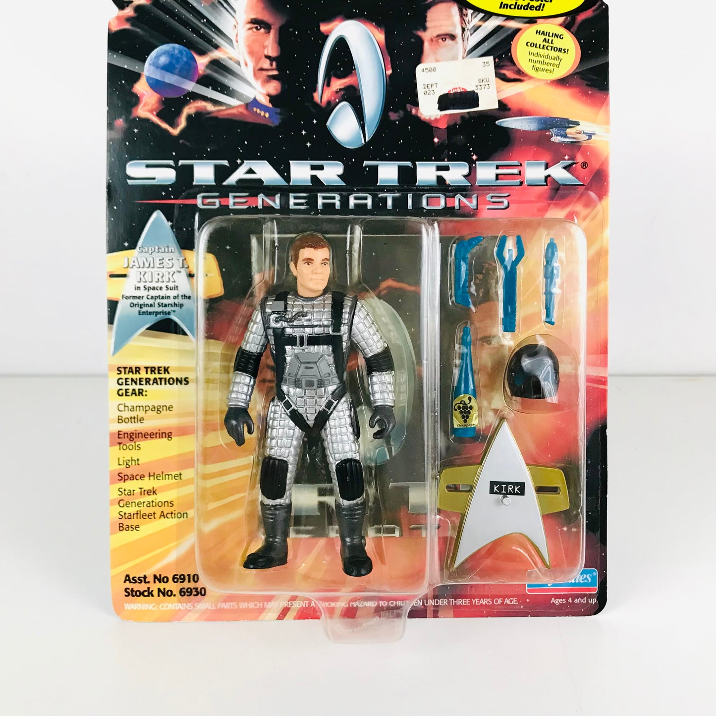 Close up of a Captain Kirk (in space suit) action figure showing various accessories.