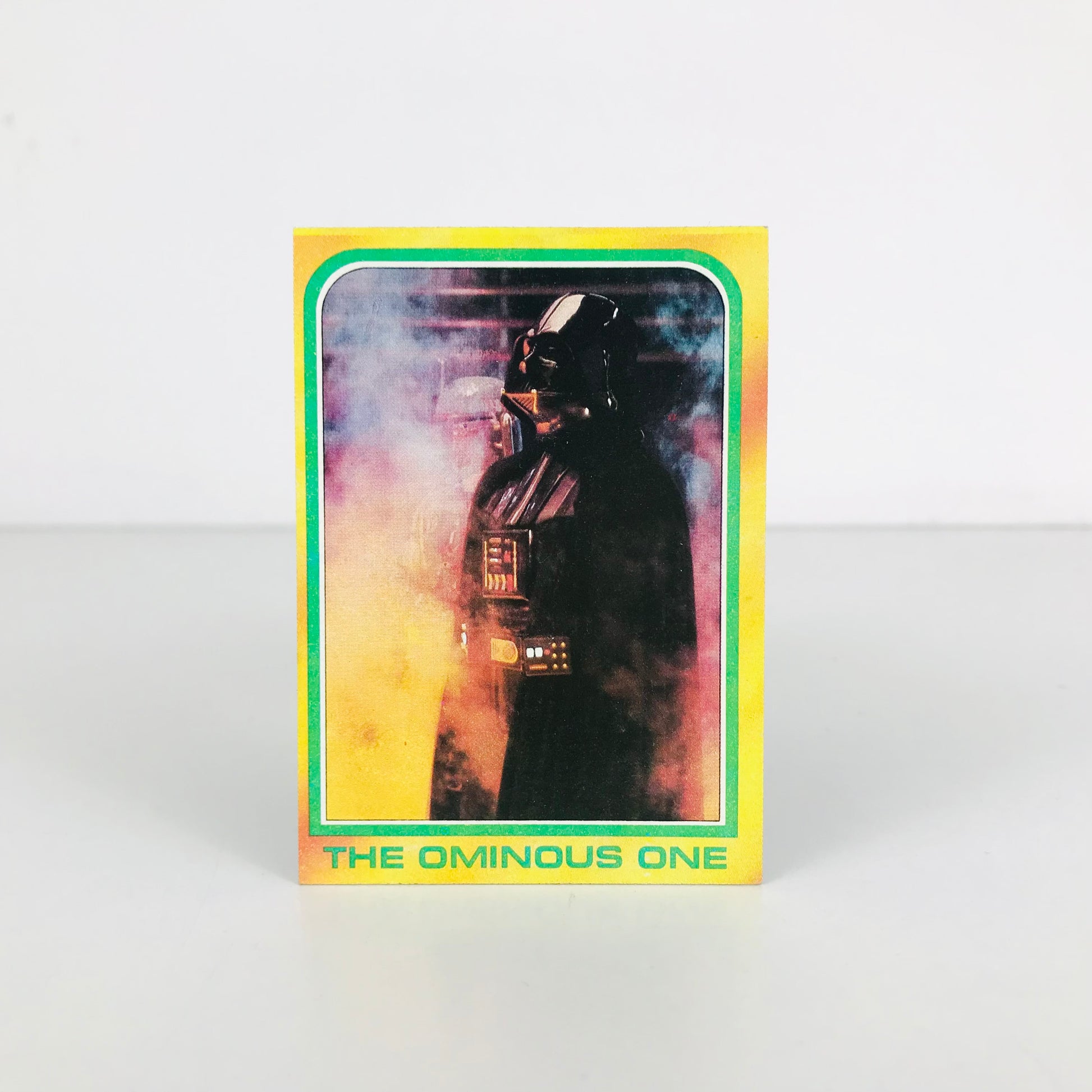 Front image of a 1980 Star Wars Darth Vader trading card with the title "The Ominous One" along the bottom.