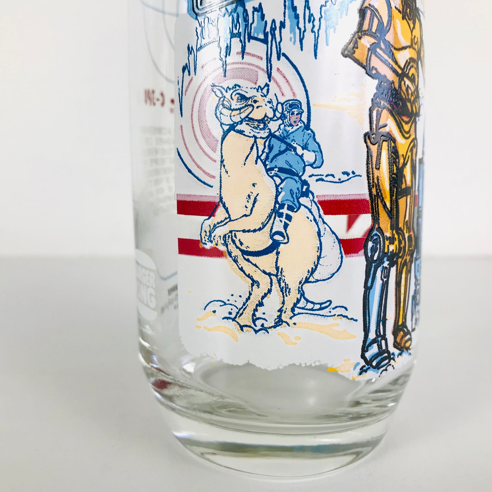 An image of Luke Skywalker aboard his Tauntaun on the side of a 1980 Star Wars drinking glass.