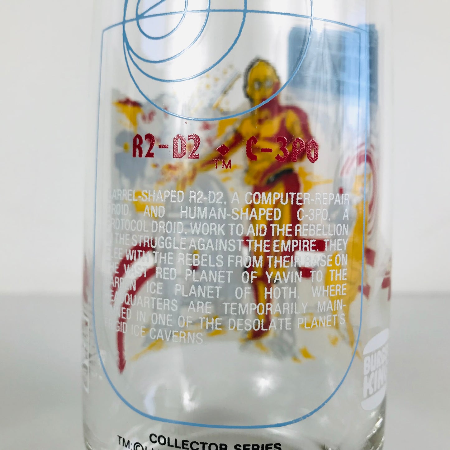 A paragraph on the back of a vintage glass tumbler describing the story of R2-D2 and C-3PO (based on their adventures in The Empire Strikes Back movie).