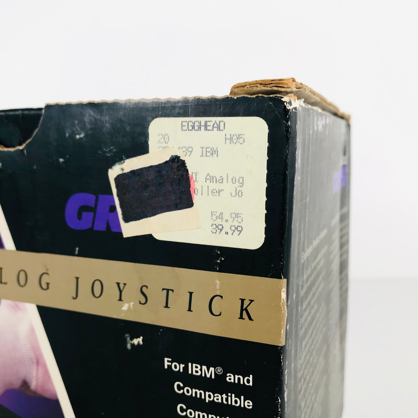 Original price sticker on a 1991 Gravis joystick showing that it was purchased at an Egghead retail location.