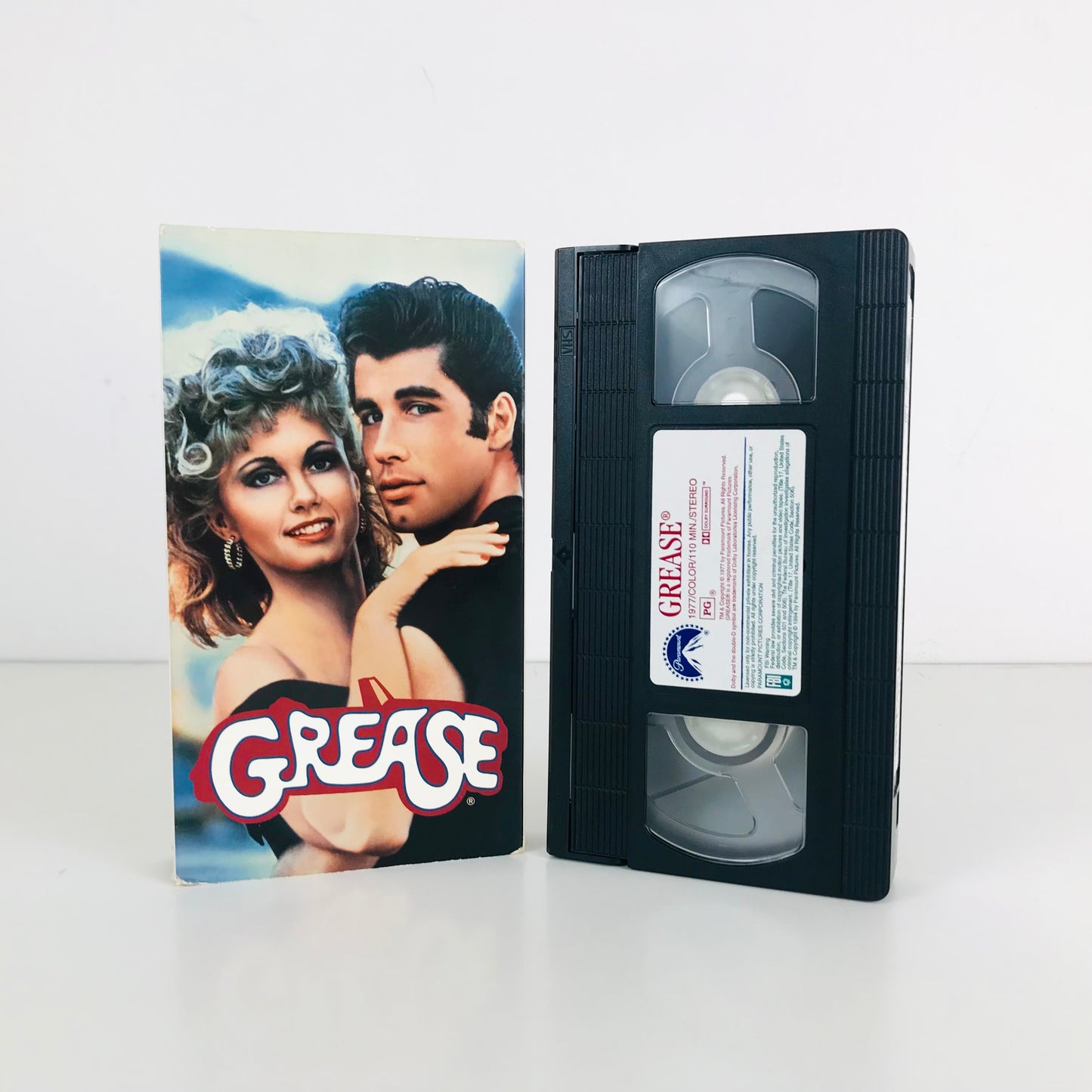 Front box and tape label image of the original 1978 Grease movie on VHS.