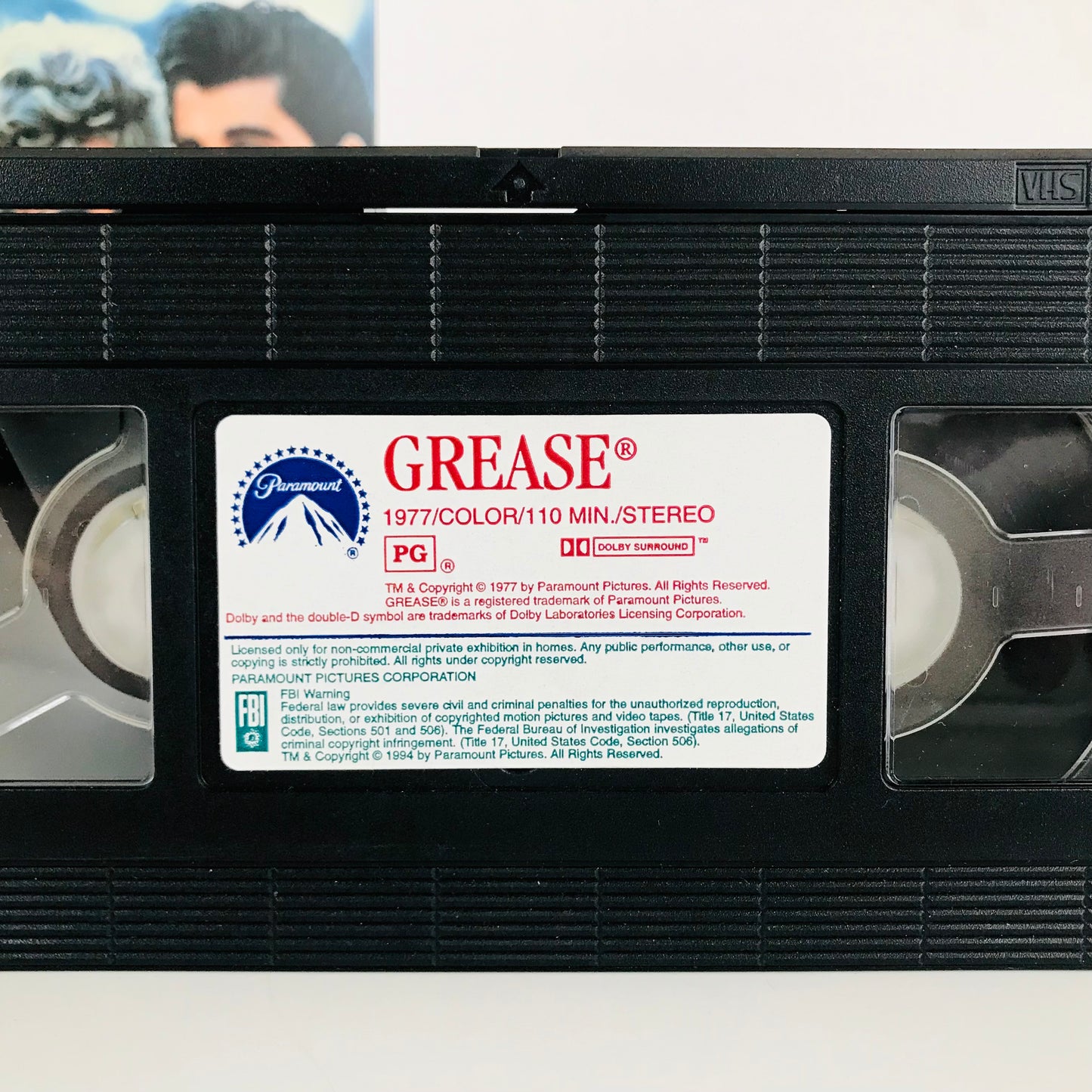 VHS tape label for Grease showing the 110-minute runtime, the Paramount Logo, and other info about the film.