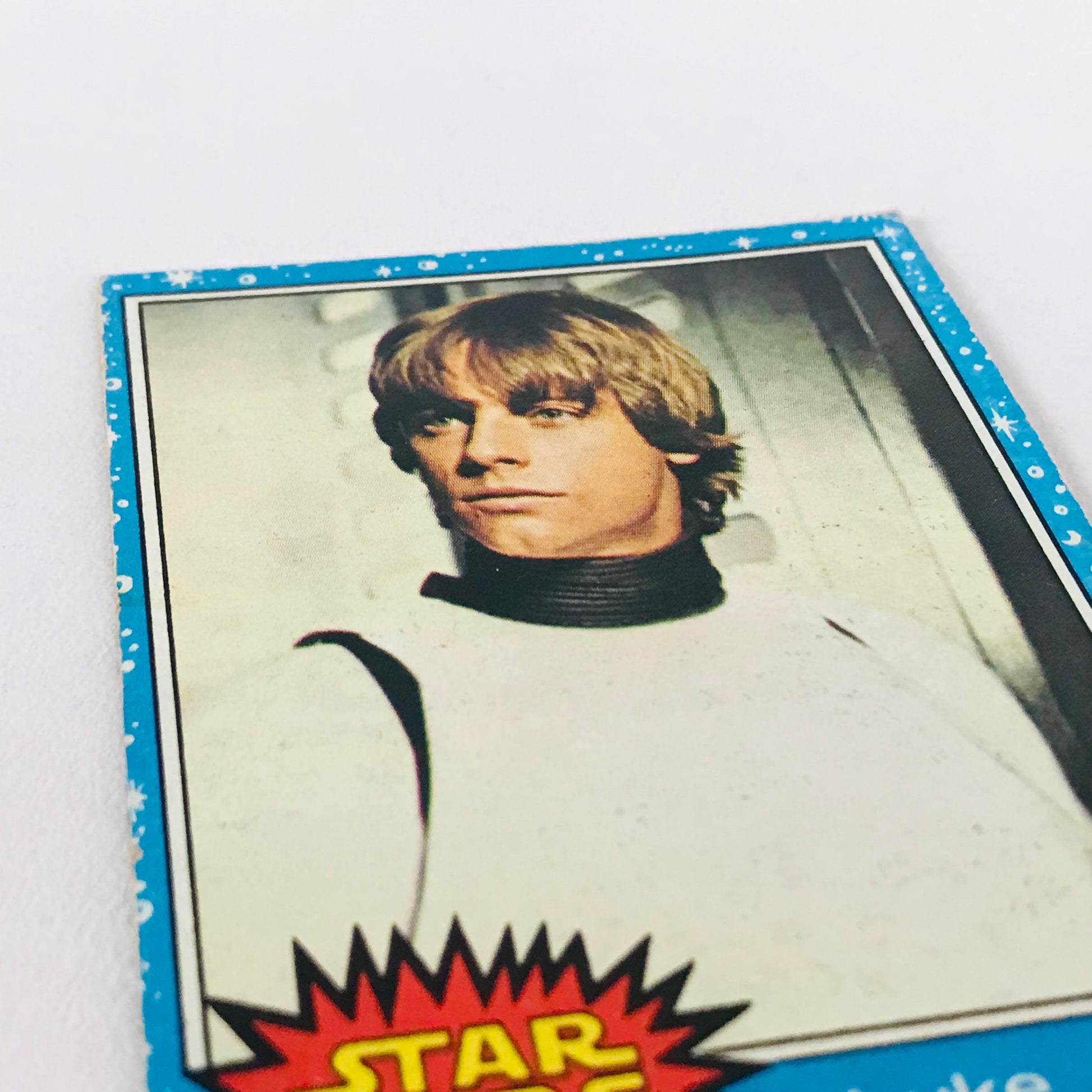 Mark Hamill as Luke Skywalker (in Stormtrooper Disguise) as seen on card #1 from the original 1977 Topps Star Wars series.