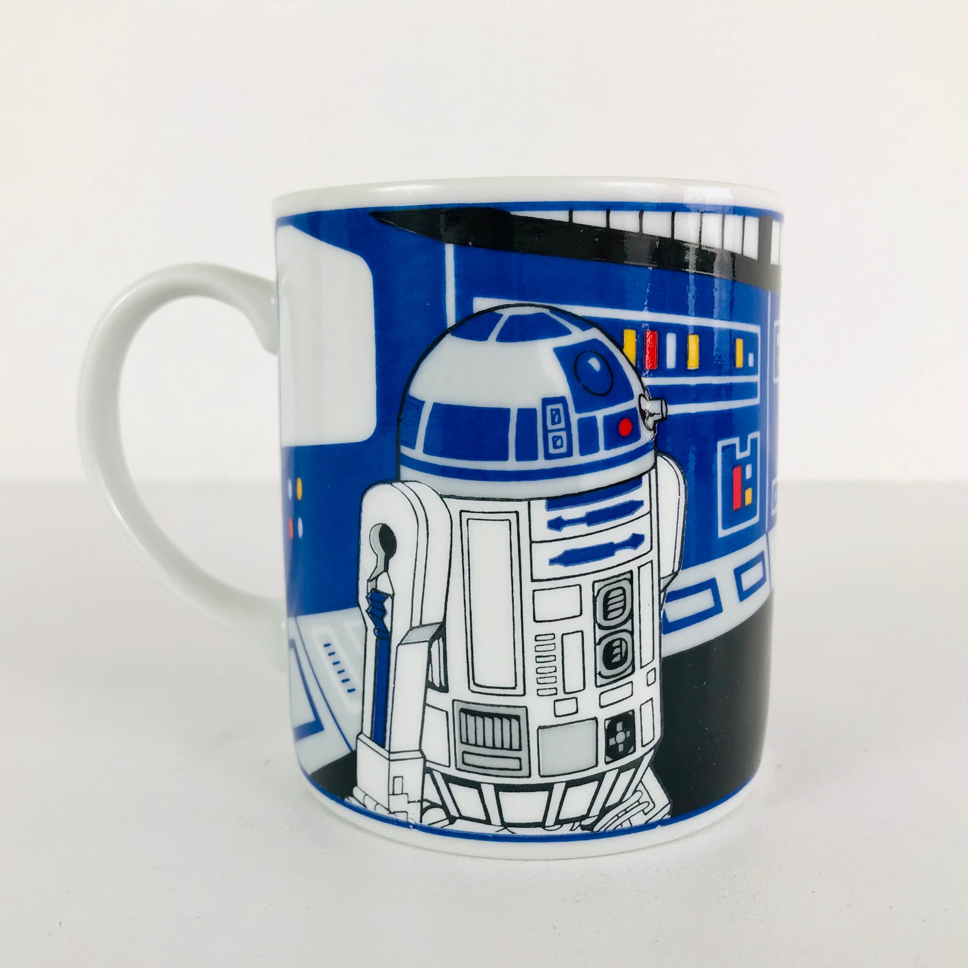 This vintage coffee mug depicts R2-D2 hacking the Bespin (Cloud City) mainframe.