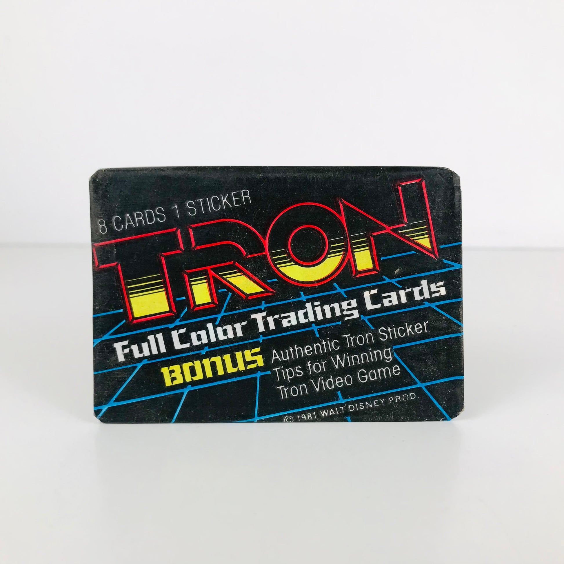 An unopened pack of 1982 Walt Disney Tron movie trading cards.