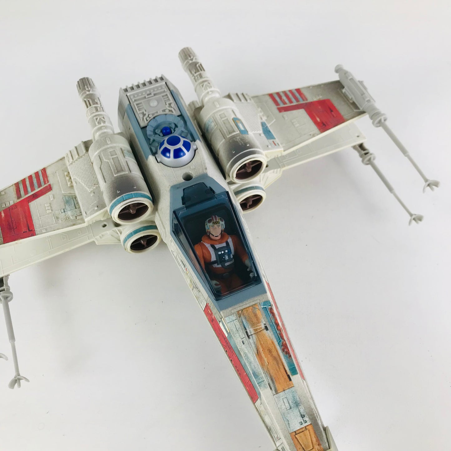 Overhead view of the 1990s Power of the Force Electronic X-Wing Fighter toy spaceship.